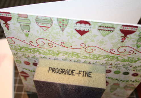 Sand all of the edges around the card except for the crease on the left side.