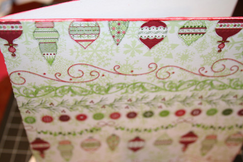 Ink the edges of the card, except for the crease on the left side, with a rubber stamp ink pad.