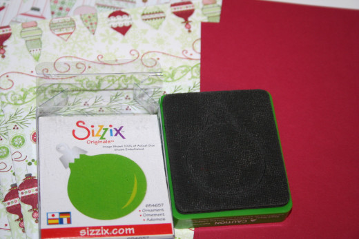 You can use store bought embellishments or make your own.  This ornament is a die-cut from Sizzix.