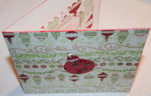 Adhere your embellishment to the outside using glue dots, liquid glue, or double-sided tape.