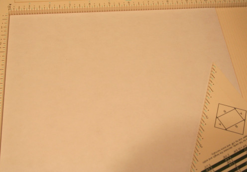 Trim a piece of 12 x 12 patterned paper to size 10 x 10.  Set your measurements to 5 1/2 around each side.  The fold.