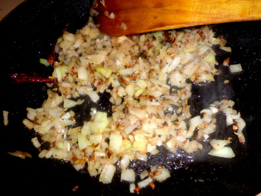 Big onion is added in the oil for frying