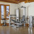ultra sleek fitness equipment by Vectra combined with wood flooring and a view of a harbor make this fitness room beyond storybook ultra sleek fitness equipment by Vectra combined with wood flooring and a view of a harbor make this fitness room beyond storybook