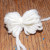 Tie the length together in the center of the bunch and pull tightly. Tie the length together in the center of the bunch and pull tightly.