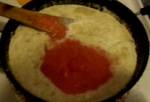 Pour tomato puree inside the pan