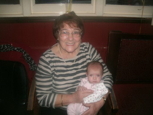 Mum, nursing her latest great grandchild in November 2013