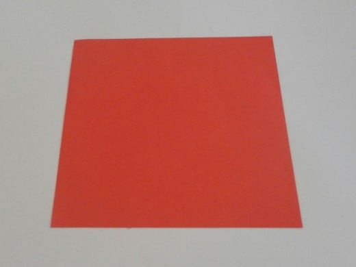 Cut out a square paper measuring 14cm by 14 cm.