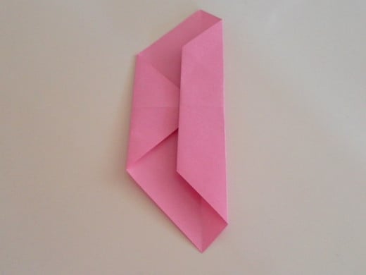 Fold one third of the right side of the paper towards the left.