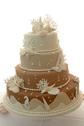 a beach-themed wedding cake