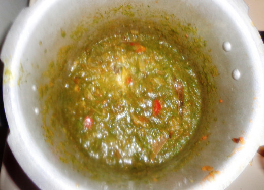 Ground masala is poured inside. Add chili powder and cook till the oil oozes out from the masala.