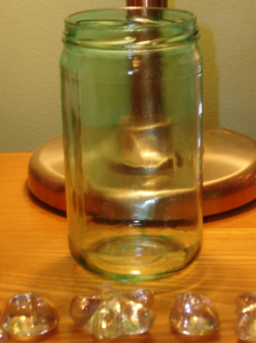 You can use almost any wide mouth jar to be used as a candle holder.
