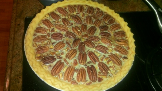 how pie should look right before putting into the oven (after arranging pecans in a decorative pattern)
