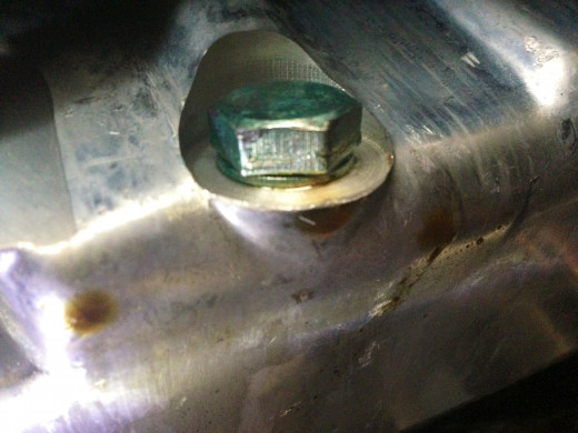 Damn you, new-but-leaky oil plug! Always replace the washer on your drain-plug and tighten to spec with a torque-wrench to help avoid this.