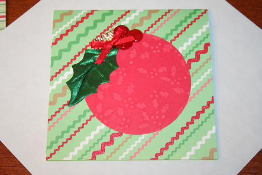 Fold the edges of the paper around each side of the card.