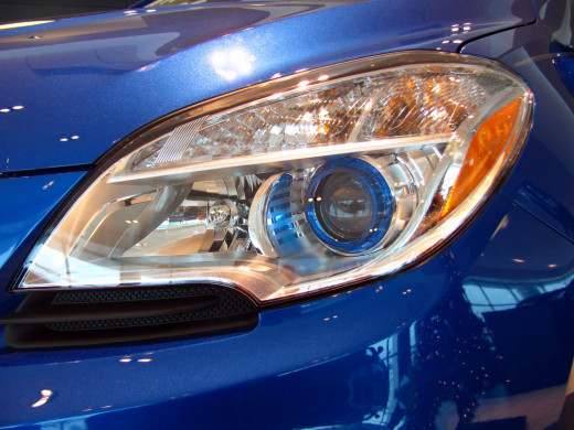 Halogen composite projector beam headlamps with blue translucent ring mirrors the interior ambient lighting accent