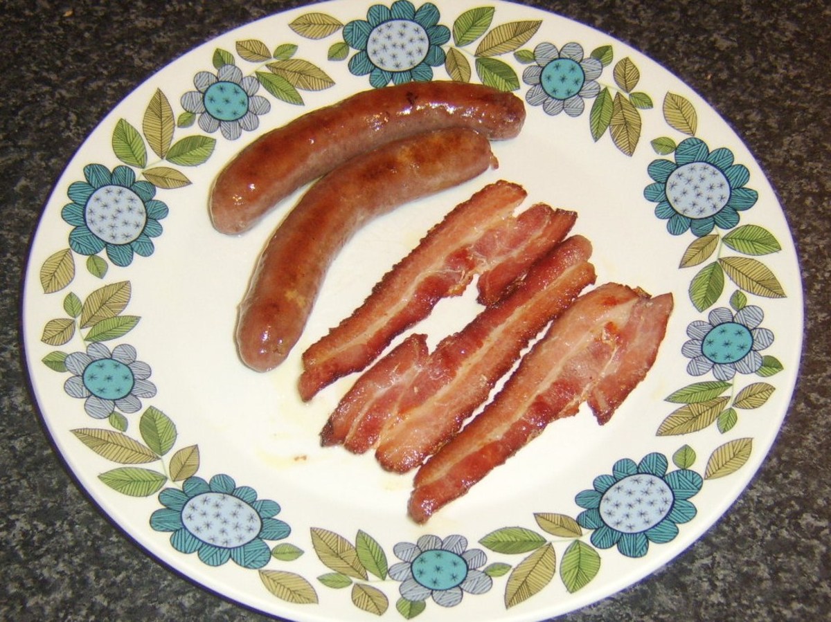Sausages and bacon removed to warmed plate