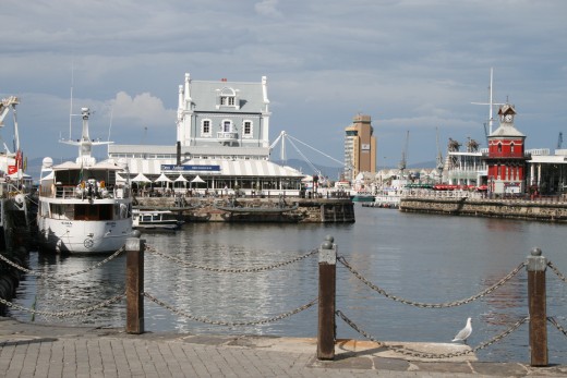 Looking across the Alfred Basin toward the Clock Tower. The Clock Tower (the red building to the right) was completed in 1882 and fully restored in 1997.