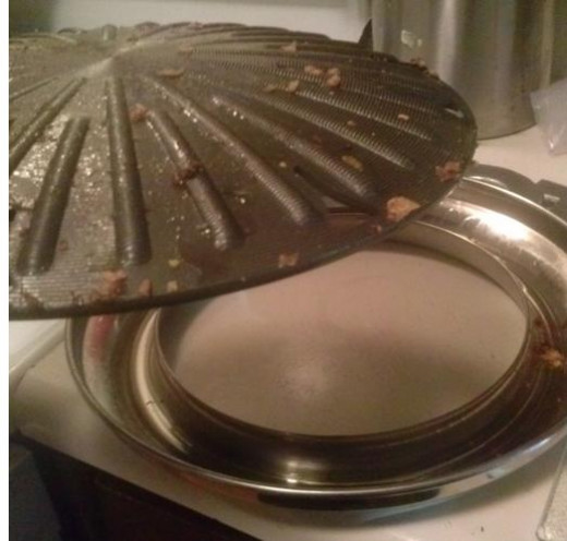 This is what I cooked my chicken with. I believe this is Teflon. It is  a nonstick material and the oils from the chicken run into the donut shaped reservoir. Both pieces fit together well. The come with handles and without.