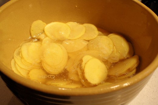 Potato Slices In Ice Water.