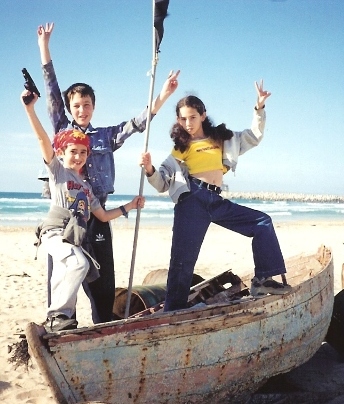 March 2001.    Reuven and his friends are playing on a beach across the road from our house. Winter sea throws out junk on the beach, so kids take advantage of it before beaches are cleaned for summer season.