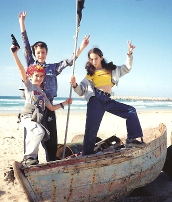 March 2001.    Reuven and his friends are playing on a beach across the road from our house. Winter sea throws out junk on the beach, so kids take advantage of it before beaches are cleaned for summer season.