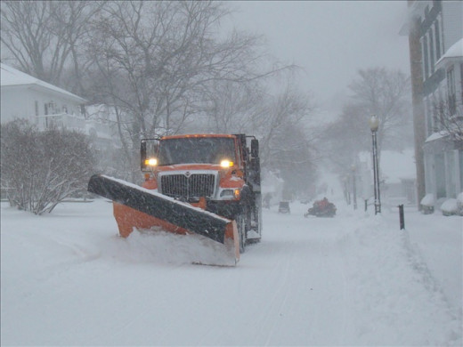 Allowing snow plows to clear the road and not passing them will benefit all drivers. 