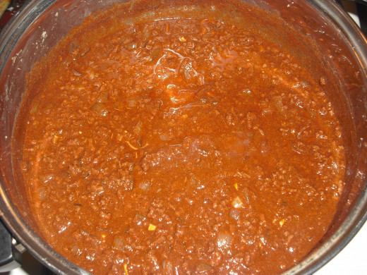 Once the cooking is complete, allow the chili to cool and place in the refrigerator overnight (or at least for a few hours).  This allows the fat to rise to the top so it can be easily removed the next day. 