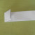 Fold the left side of the paper along the first vertical crease line. Fold the left side of the paper along the first vertical crease line.