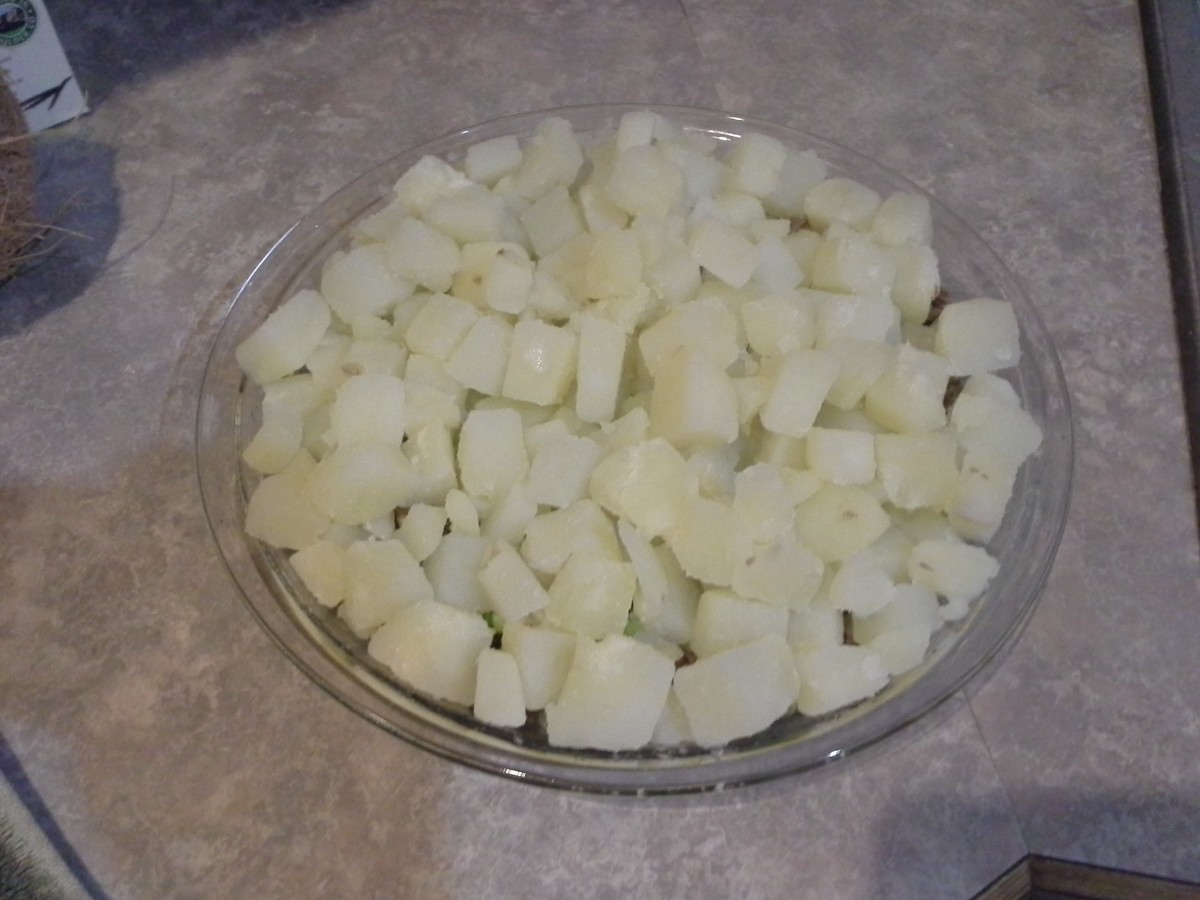 Step Five: Layer the potatoes on top of your hamburger and onions