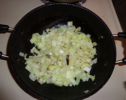 Onions are added for frying