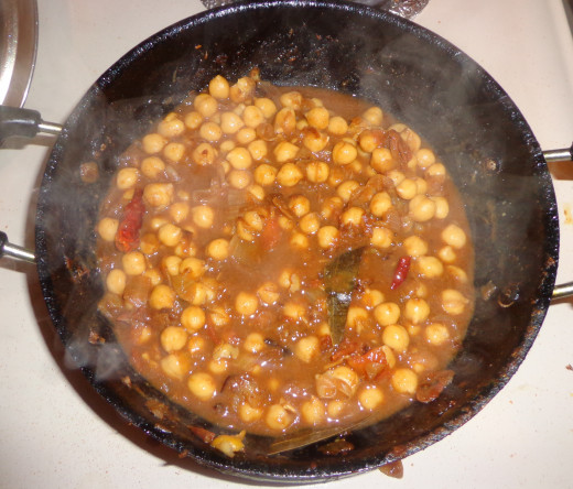 Cooked channa is added in the pan