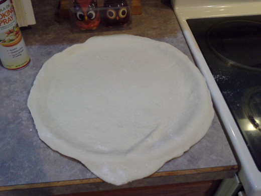 Step Two: Lay out your pizza crust dough on your pizza pan