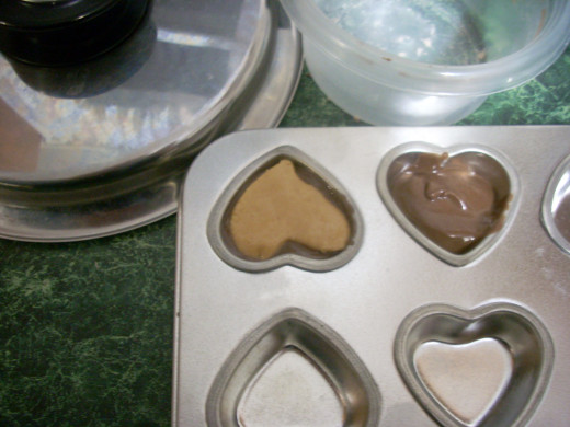 Adding the Peanut Butter Hearts to the Carob Mixture