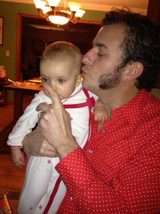 Author and artist Ben Zoltak snuggling up to his youngest daughter Nahele, during one of those fleeting, tender moments
