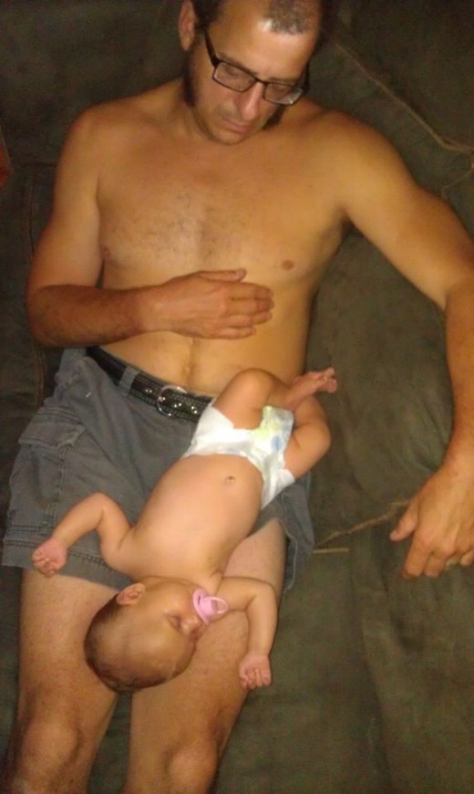 Ben Zoltak and his daughter exhausted after a long day of crying, peeing and pooping together and apart
