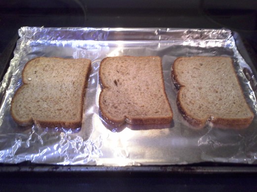 Step Two: Lay out your bread on your cookie sheet; I can usually make up to six pieces at a time
