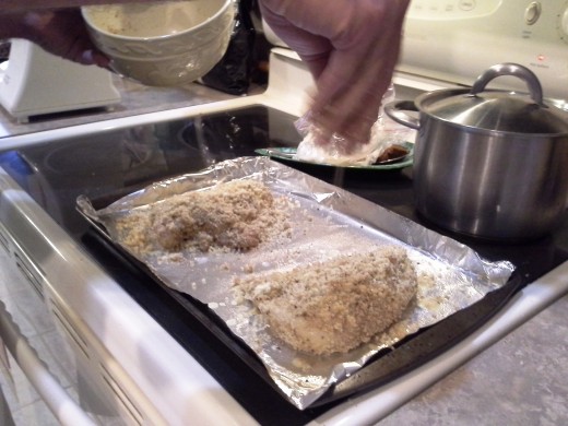 Step Twenty-three: Sprinkle your coated chicken breasts with your leftover bread crumbs