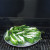 The peppers are placed on the grill. The pan has holes on the bottom to help the peppers cook to perfection. The peppers are placed on the grill. The pan has holes on the bottom to help the peppers cook to perfection.