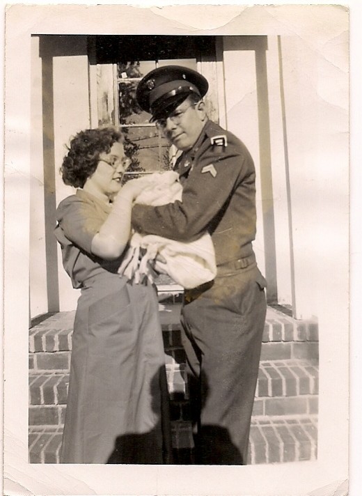 My mother, father and me after I was born on base in Fort Monmouth, New Jersey
