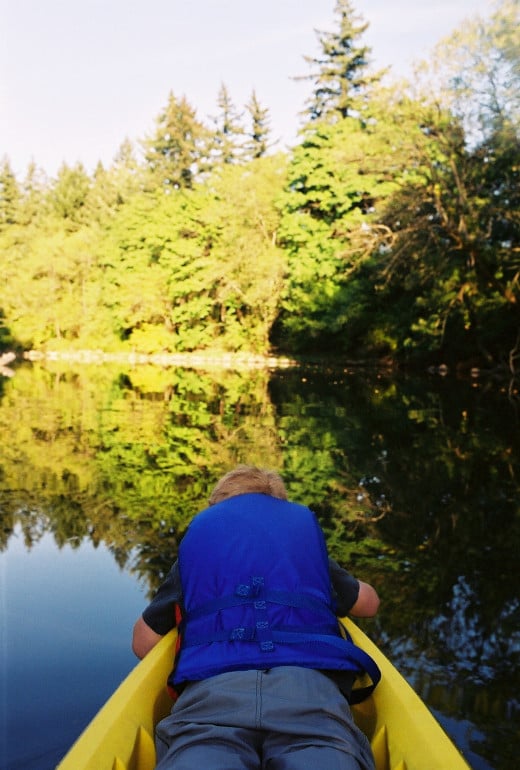 My son in the bow of my kayak as we explore the Tualatin River.