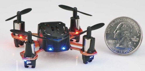 The quadcopter compared in size to a regulation size United States quarter.