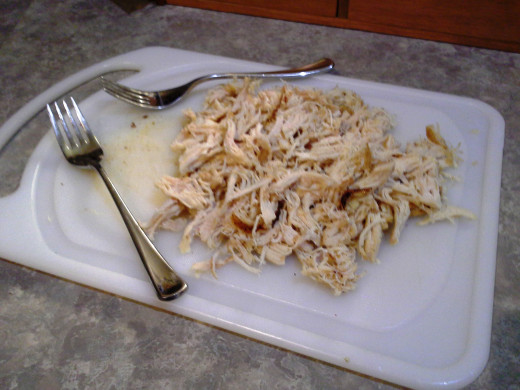 Step Ten: With two forks, shred your chicken by holding your chicken in place with one fork and shredding with the other