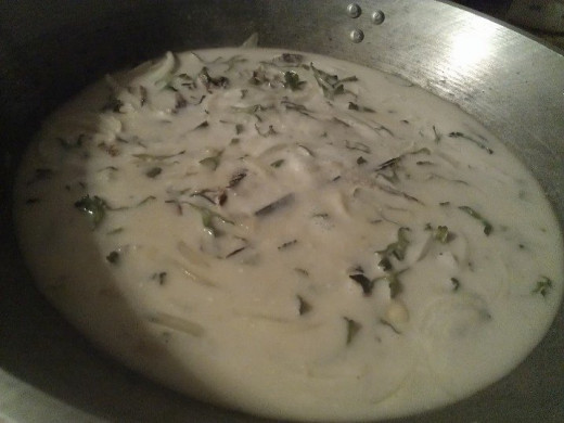 Cooking winged bean in coconut milk. 