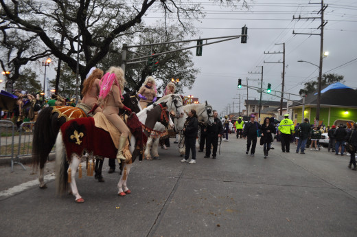 The Lady Godivas ride between the floats