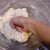 Step Eight: When it starts thickening into a doughy texture, knead it with your hands to combine