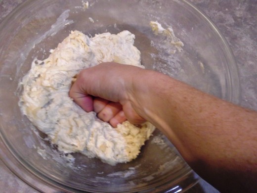 Step Eight: When it starts thickening into a doughy texture, knead it with your hands to combine