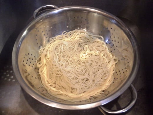 Step Seven: When your noodles are finished, pour them into a strainer in the sink