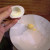Step Eleven: Using your fingers to push from the back, push the yolks out into a mixing bowl