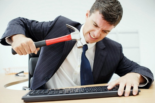 Surveys reveal stress is causing office workers to erupt in outbursts of 'desk rage'.