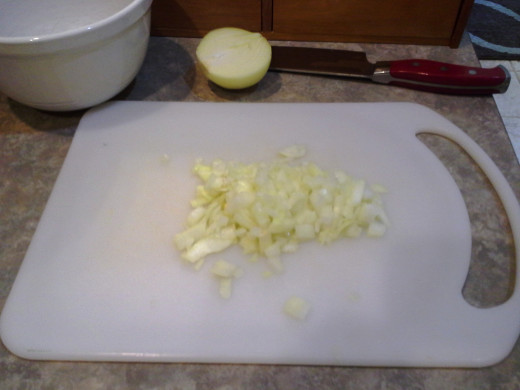 Step Fourteen: Chop half of it into small pieces and pour it into a bowl on the side; we've got tons more veggies coming